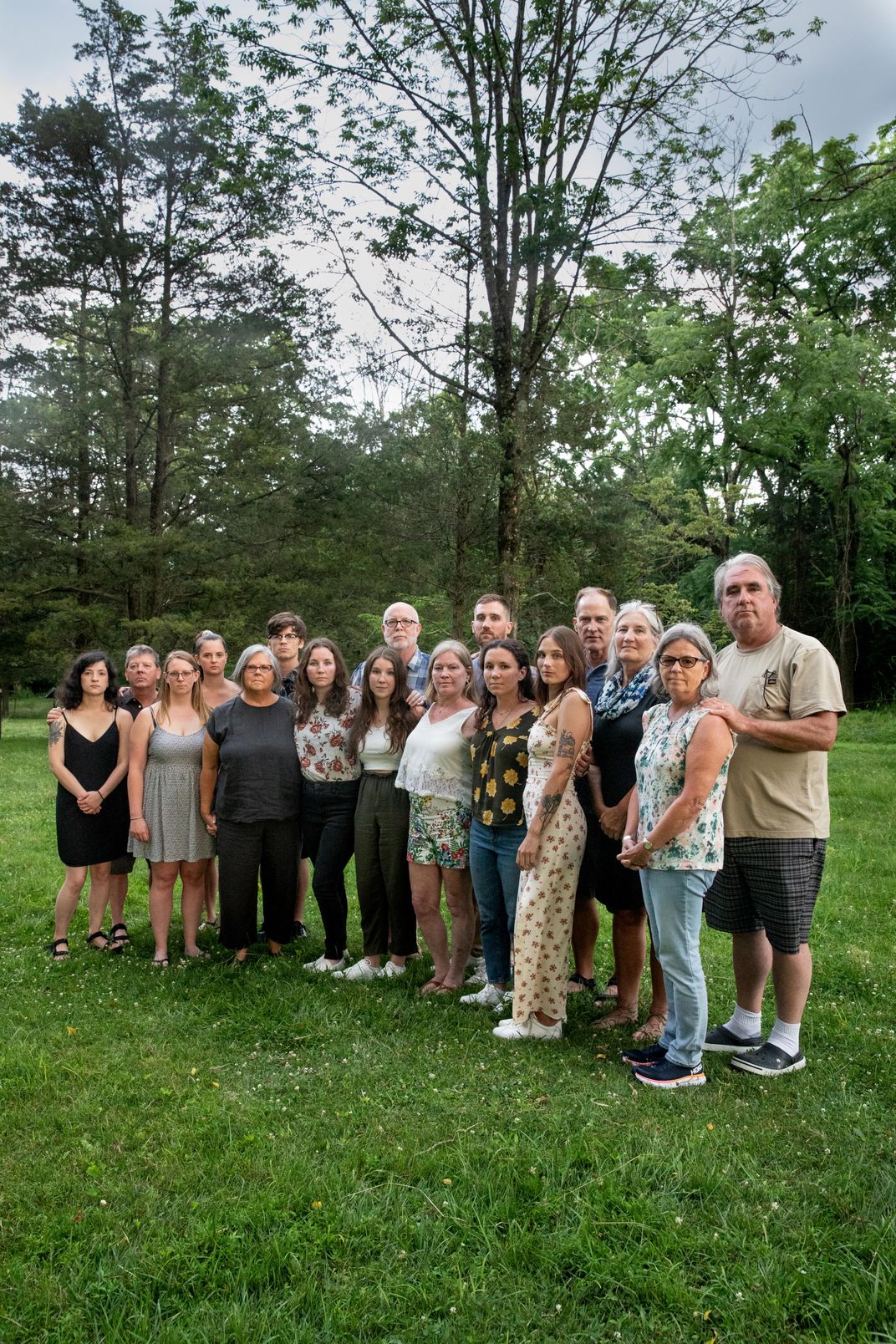 a family portrait in a backyard