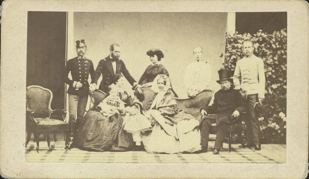 A family portrait, with Franz Joseph first on the left in the back row and Elisabeth, holding Crown Prince Rudolf, first in the front row