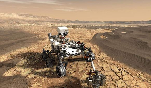 Artist’s conception of the Perseverance rover sampling rocks on the floor of Jezero crater. The rover also carries the Ingenuity helicopter (not shown) that can fly in advance of the rover and scout out high priority rocks and outcrops for the rover to visit. (NASA)