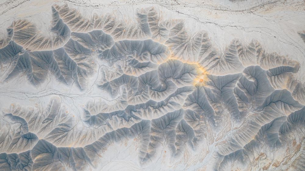 This aerial photograph taken with a drone shows a small portion of the slopes surrounding the buttes in the Utah Badlands. This image make us wonder how complex and fascinating the process of erosion is that has led to what we see today.