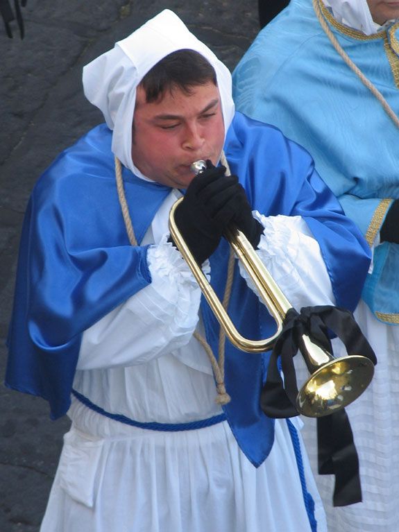 A horn-blower announces the start of the procession, which winds along the island’s south coast.