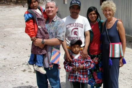 Rod (left, holding child) and Ingrid (far right) McCarroll of Alberta, shown here in central Mexico, have traveled the world helping to bring a cheap and effective water filtration system to many thousands of people.