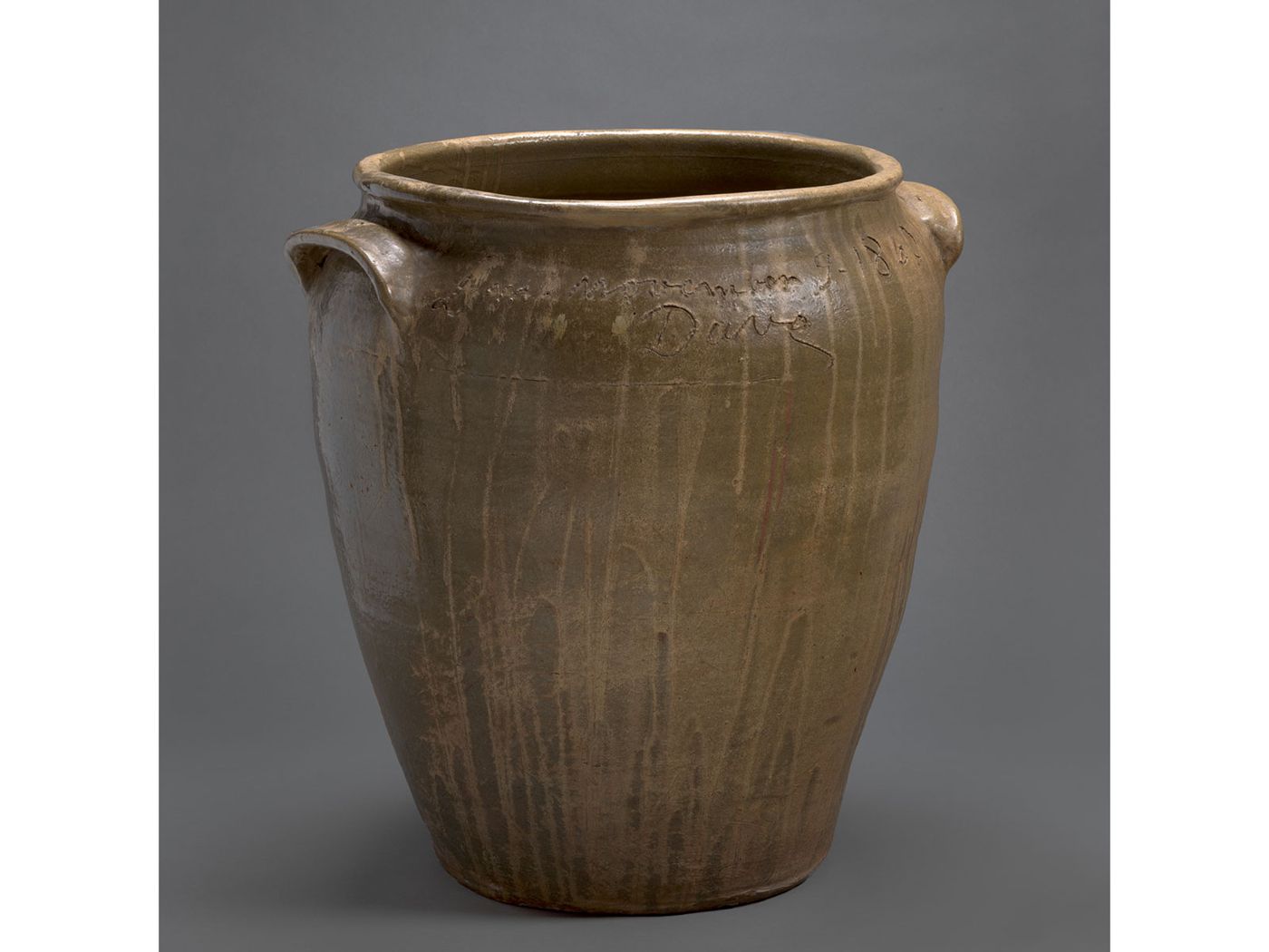 Inscribed brown-green vessel