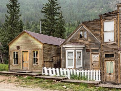 Abandoned wooden houses line the main street in St. Elmo, Colorado. 