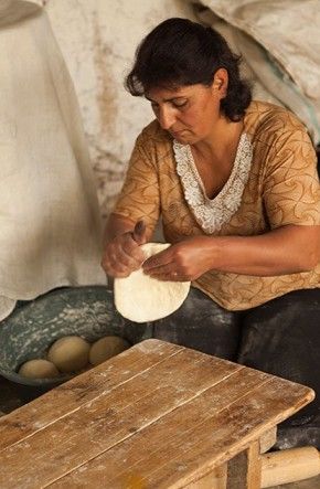 Rima prepares dough for baking
