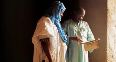 Preservationists (including Allimam Achahi, far left, and Abdel Kader Haidara) are trying to rescue the city's rare manuscripts from centuries of neglect. "They must be protected," says Haidara.