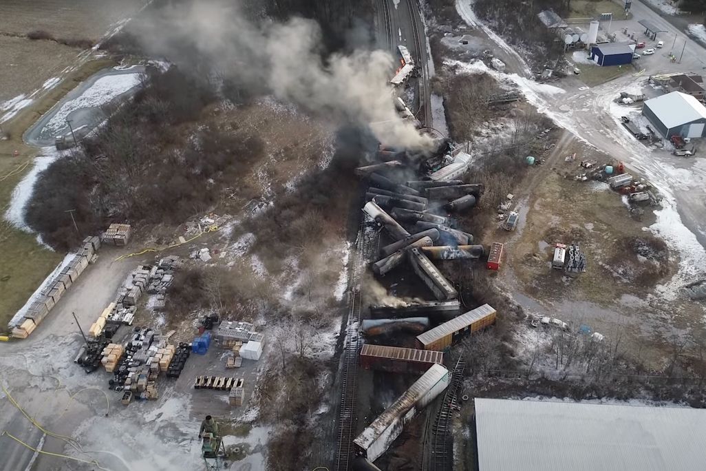 A video screenshot showing the site of the derailed train