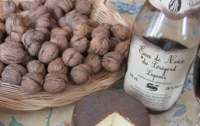 A tabletop laden with goodies showcases the nut culture of the French Périgord, where locals make cheese, bread, oil and liqueur using the area’s walnuts.