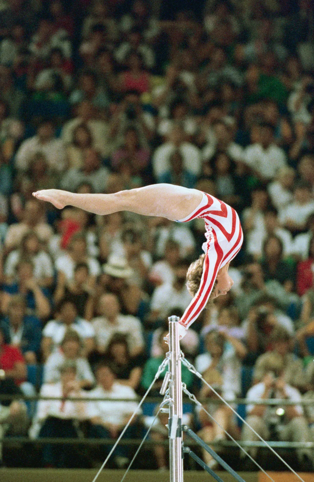 Mary Lou Retton performing on the uneven bars in Los Angeles