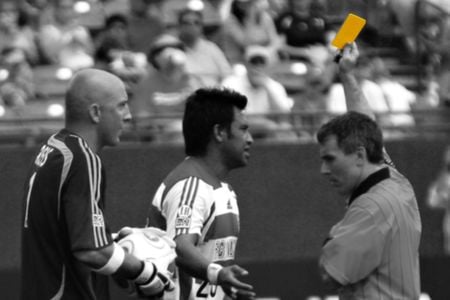 The yellow card is an elegant design solution that has been adopted by several sports. 