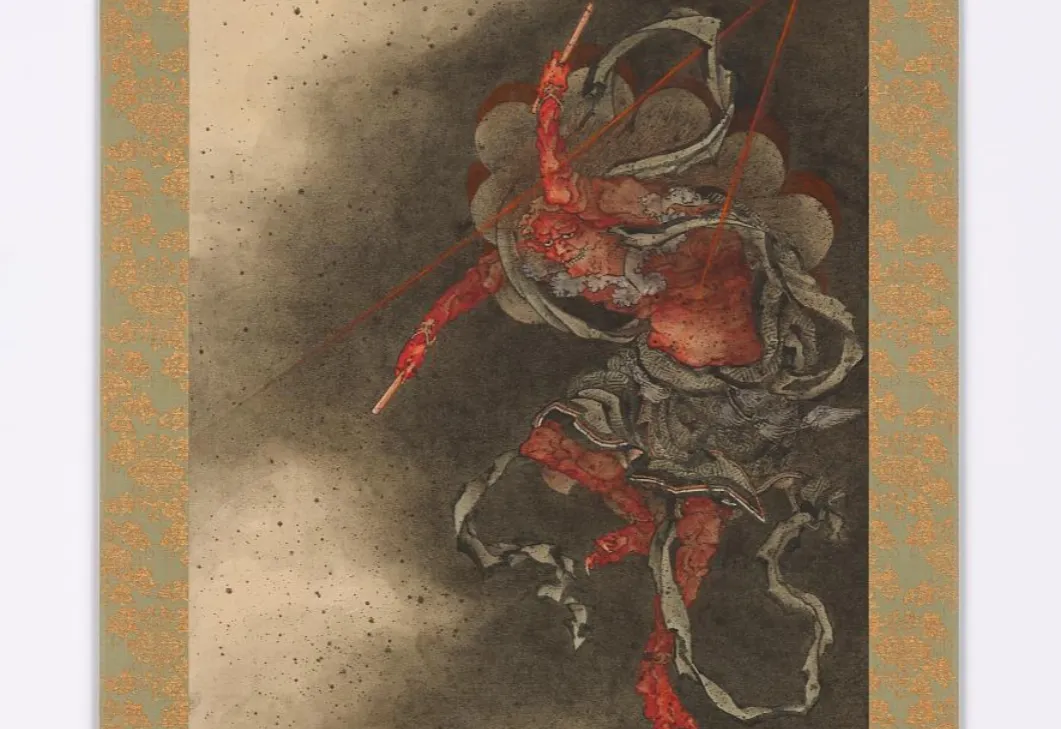 The background of the hanging scroll shows a large, swirling cloud against a black sky with red laser beams from lightning bolts shooting out of the corner of the painting.  The equally dynamic god of thunder hovers in front of the ominous sky