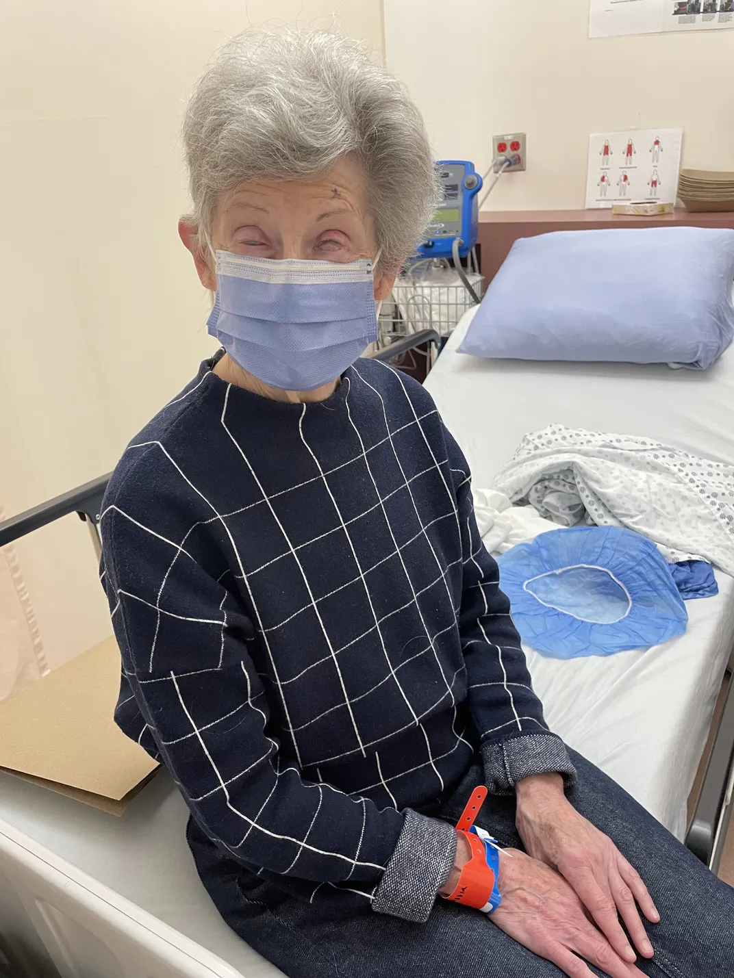 Older woman wearing a blue face mask