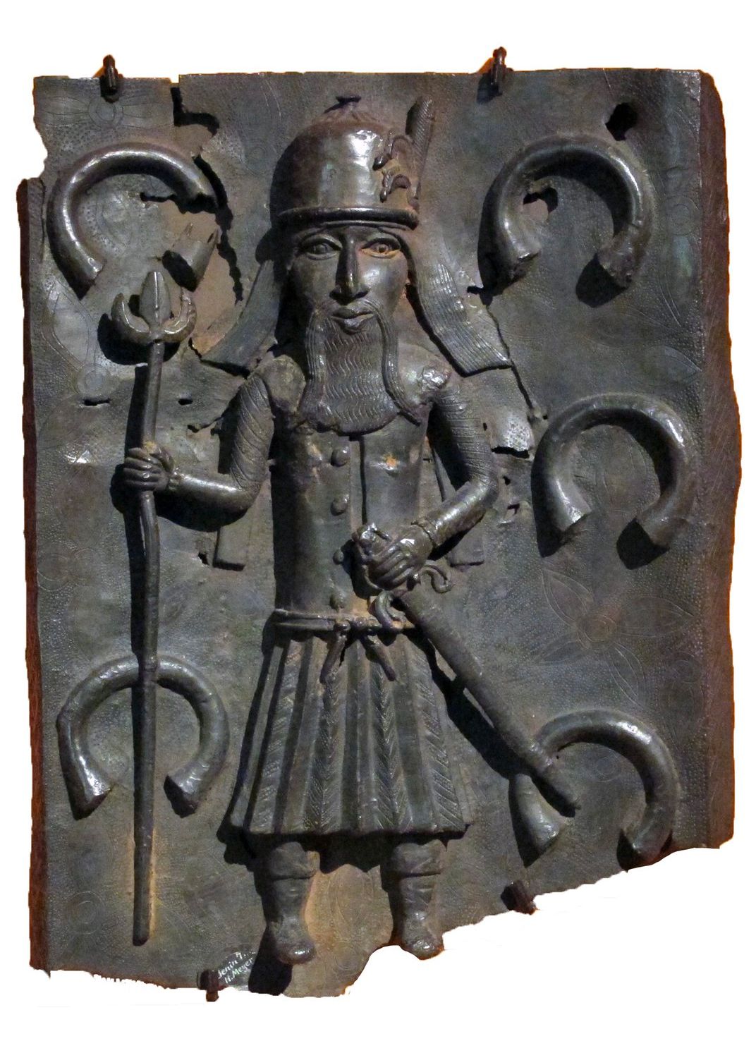 A 16th-century Benin Bronze depicting a Portuguese soldier flanked by manilla bracelets