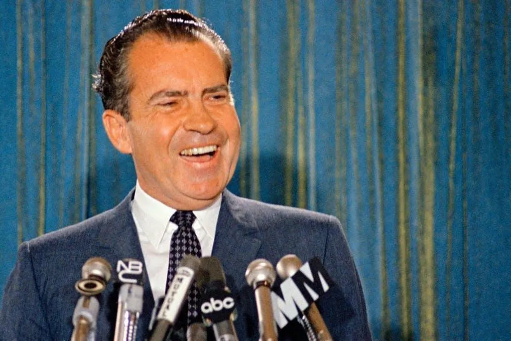 Republican presidential candidate Richard Nixon smiles for the cameras during a 1968 news conference.