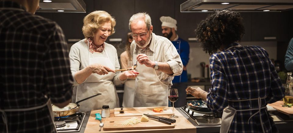  Sampling the recipe during a cooking class 