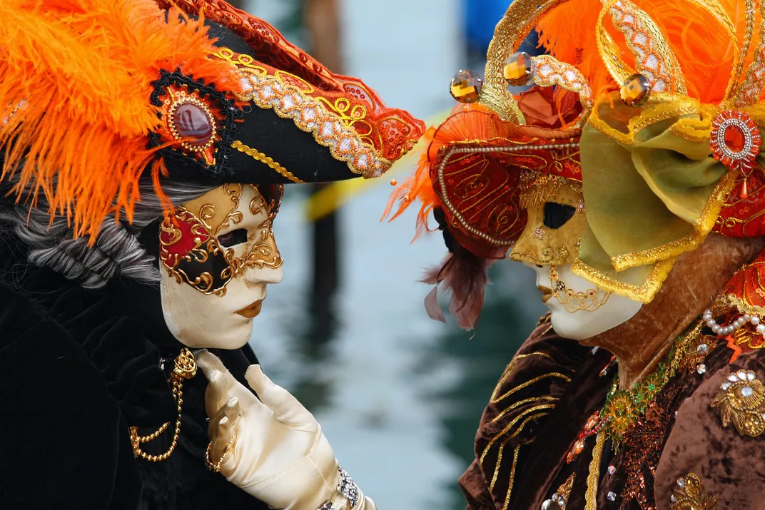 Masked revelers participating in Venice Carnival in 2010