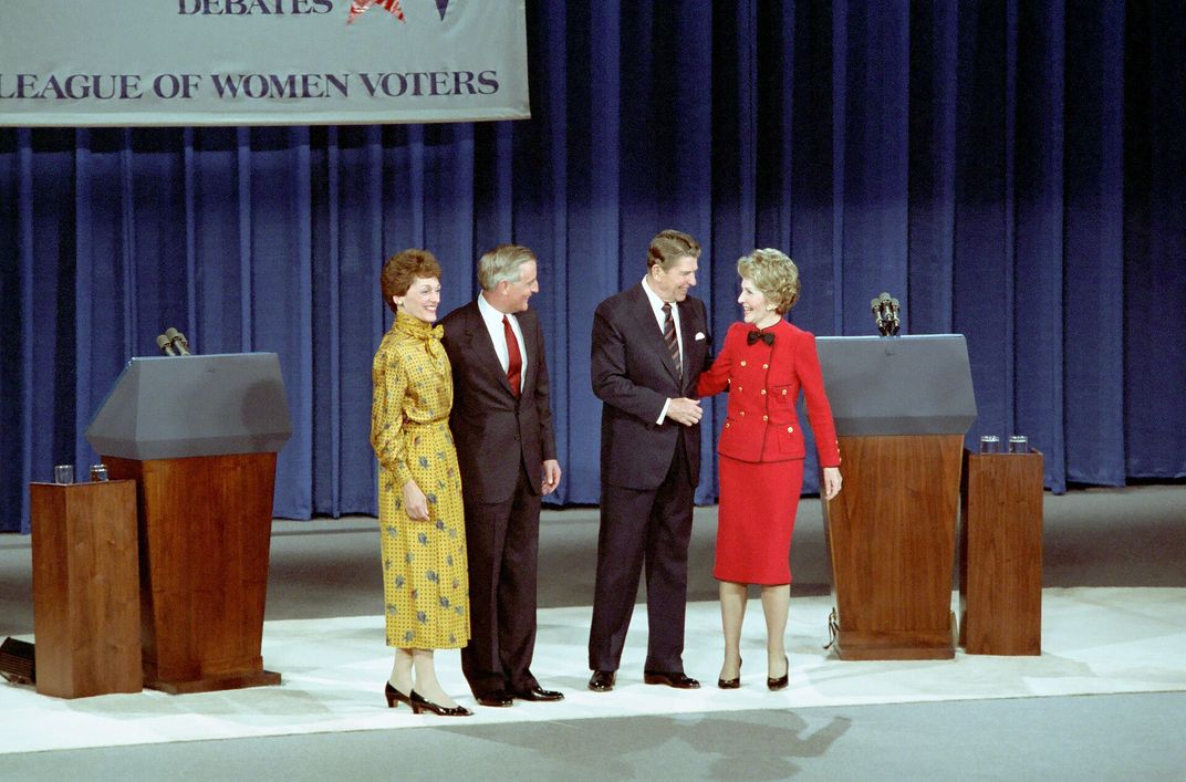 Joan Mondale, Walter Mondale, Ronald Reagan and Nancy Reagan pose on the stage after the first presidential debate on October 7, 1984.