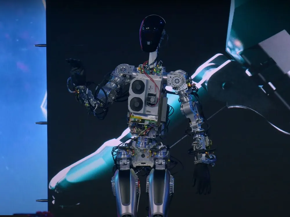 A robot stands on stage