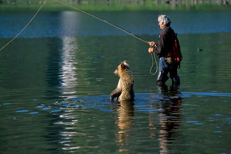 Russell and his partner Maureen Enns befriended wild bears, spending months each year living among them—romping, swimming, and fishing.