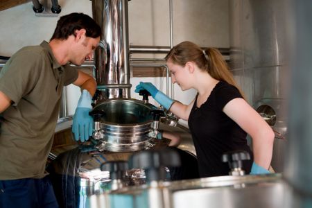 Brewers at work making beer