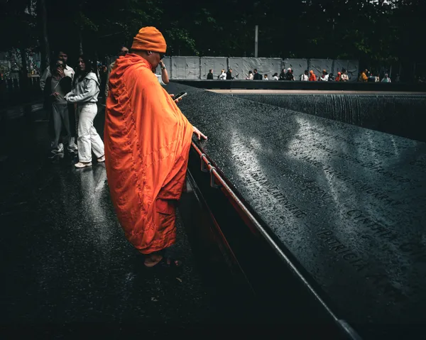 Buddhist monk at 9/11 Memorial Pools thumbnail