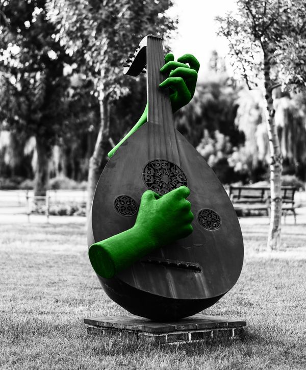 Musical instrument statue in park thumbnail