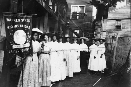 Nine African American women gather for the Banner State Woman's National Baptist Convention in 1915
