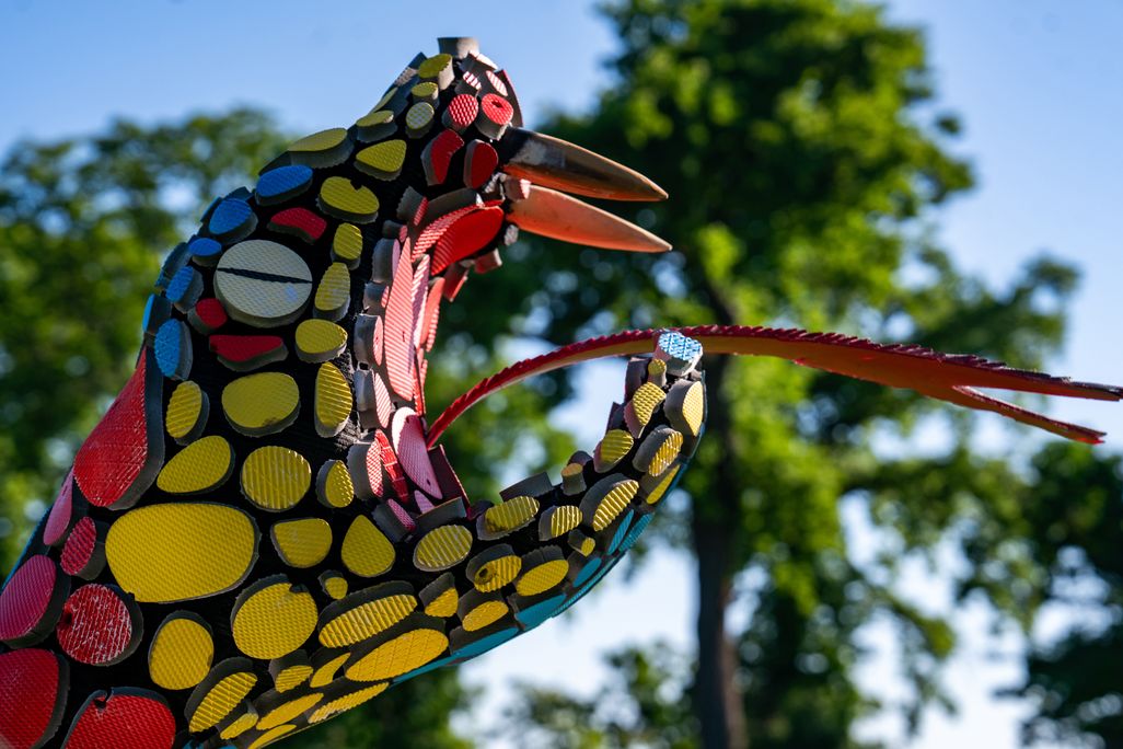 Sculpture of snake with open mouth and tongue protruding