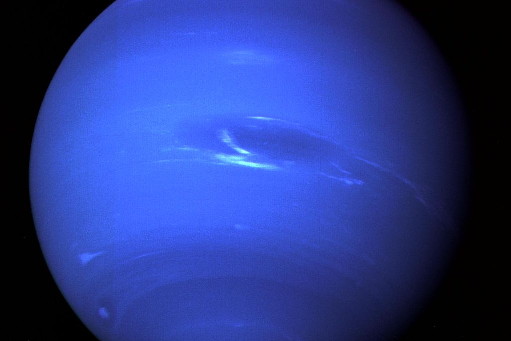 A photo of Neptune highlighting its deep blue color and Great Dark Spot in its center