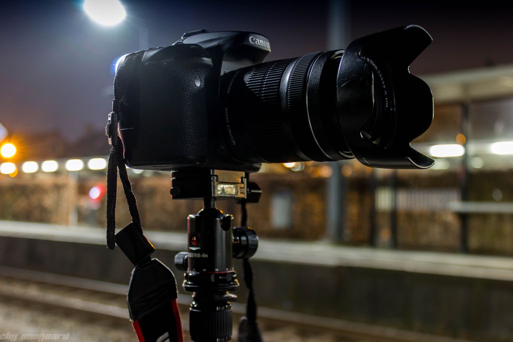 An image of a Canon camera resting on a tripod