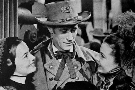 Photo of Olivia de Havilland (left), Leslie Howard (center) and Vivien Leigh (right) from Gone With The Wind.