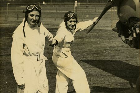 Rubye Berau (left) with her human cargo, parachutist Babe Smith, circa 1930s. 