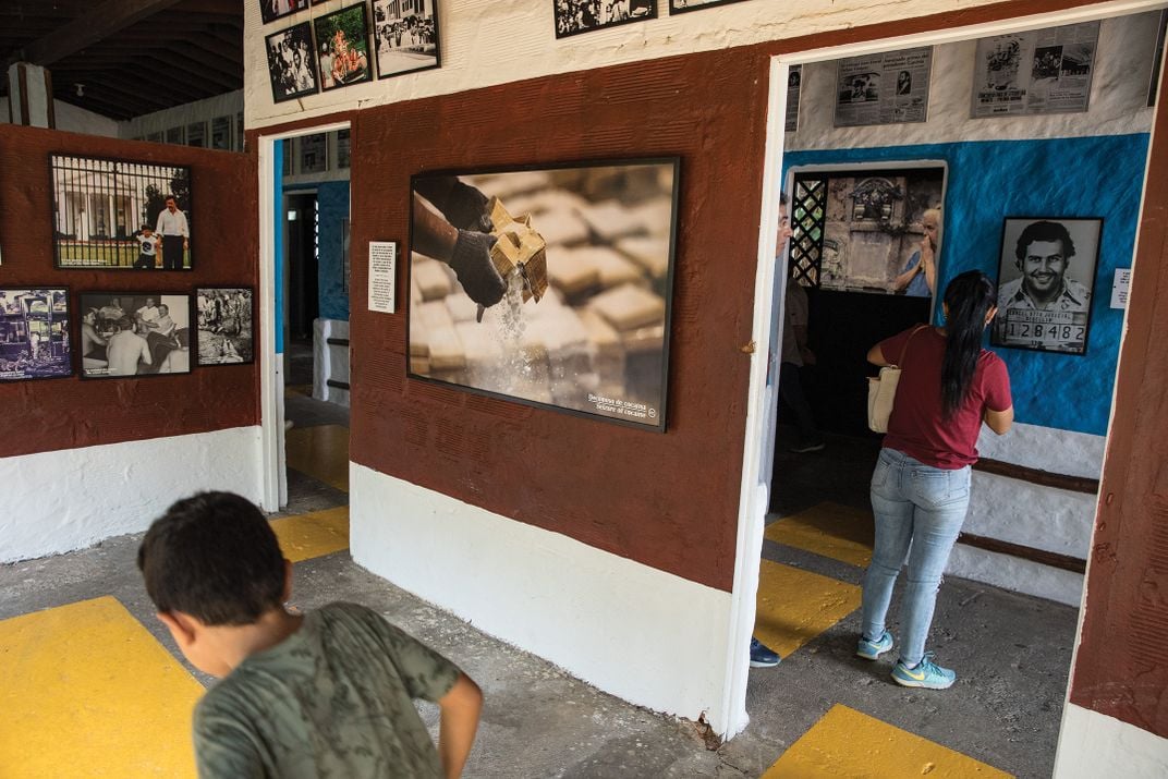 Visitors wander the exhibition, set in Escobar's former private villa.
