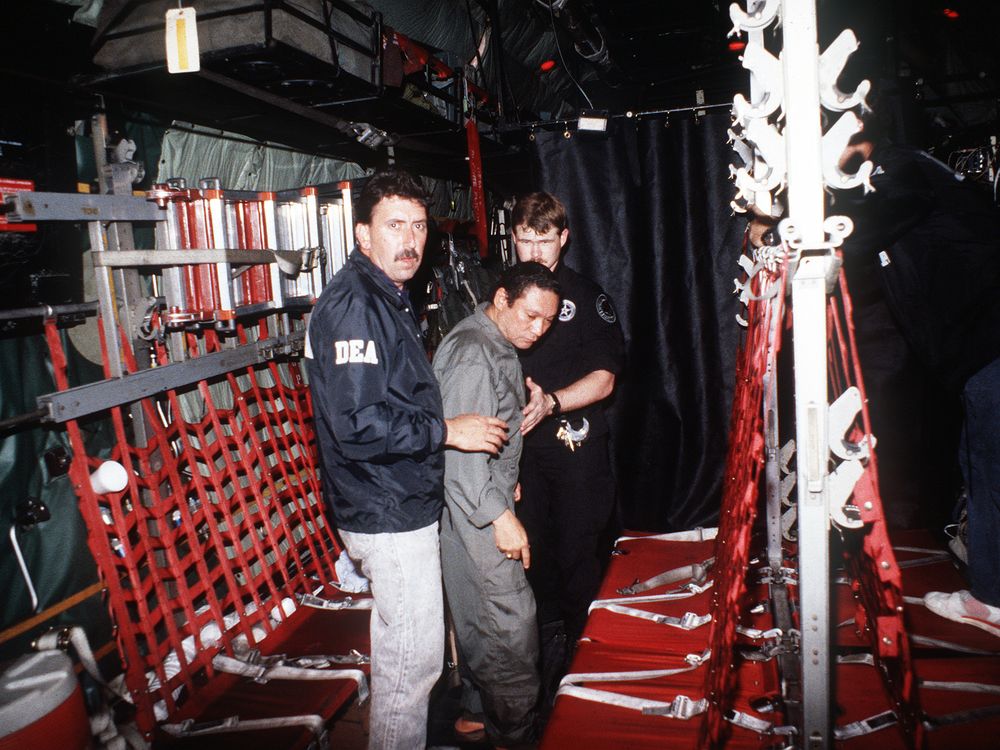 Manuel_Noriega_with_agents_from_the_U.S._DEA.jpg