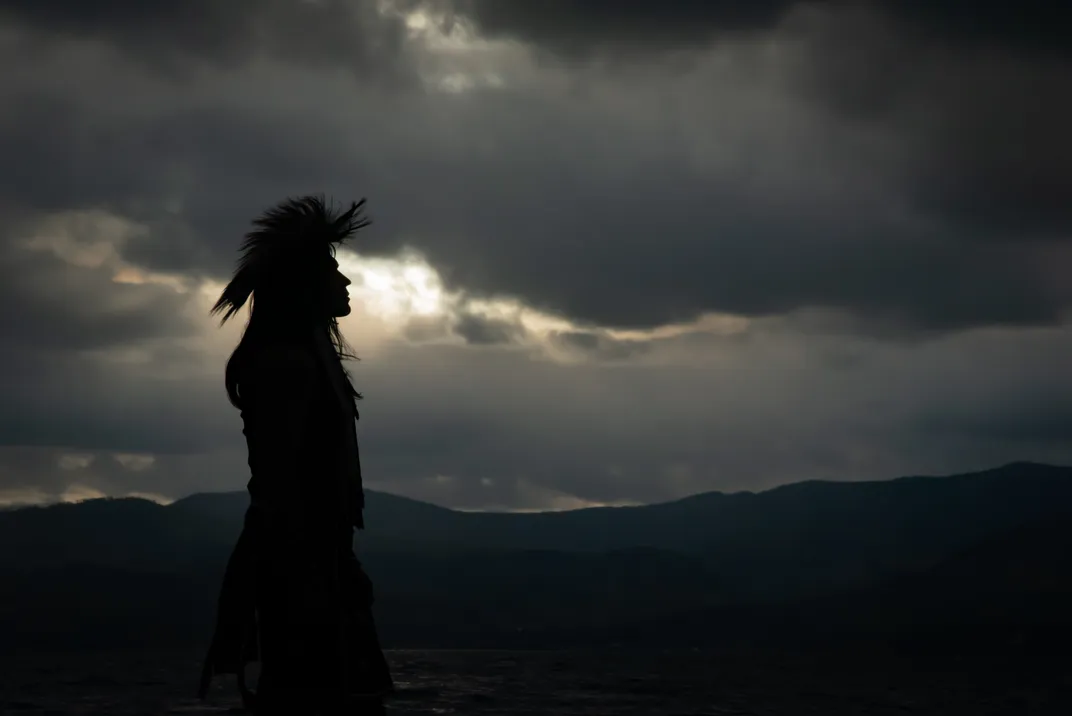15 - Clouds obscure the sun, creating a silhouette of Native American Jonas Rydell.