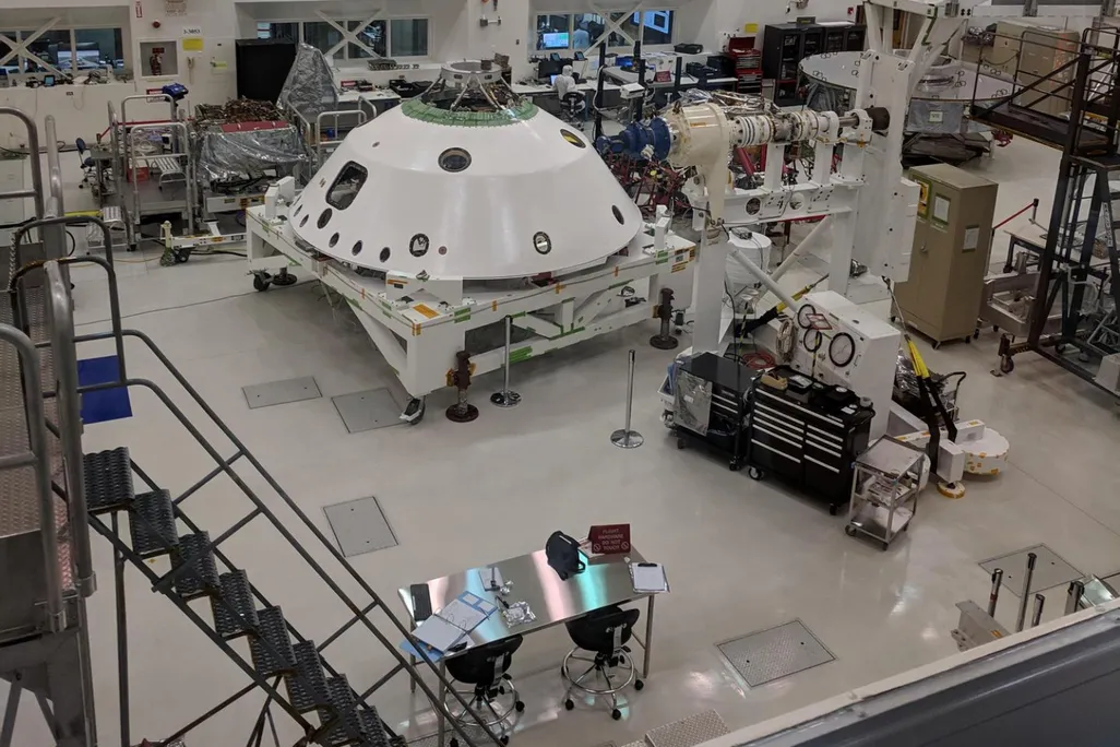 A NASA cleanroom as seen from an elevated point of view with lots of equipment