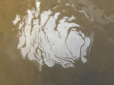 Mars' south polar cap as it appeared to the Mars Global Surveyor (MGS) Mars Orbiter Camera (MOC) on April 17, 2000. Strong evidence of an underground lake was found nearby.
