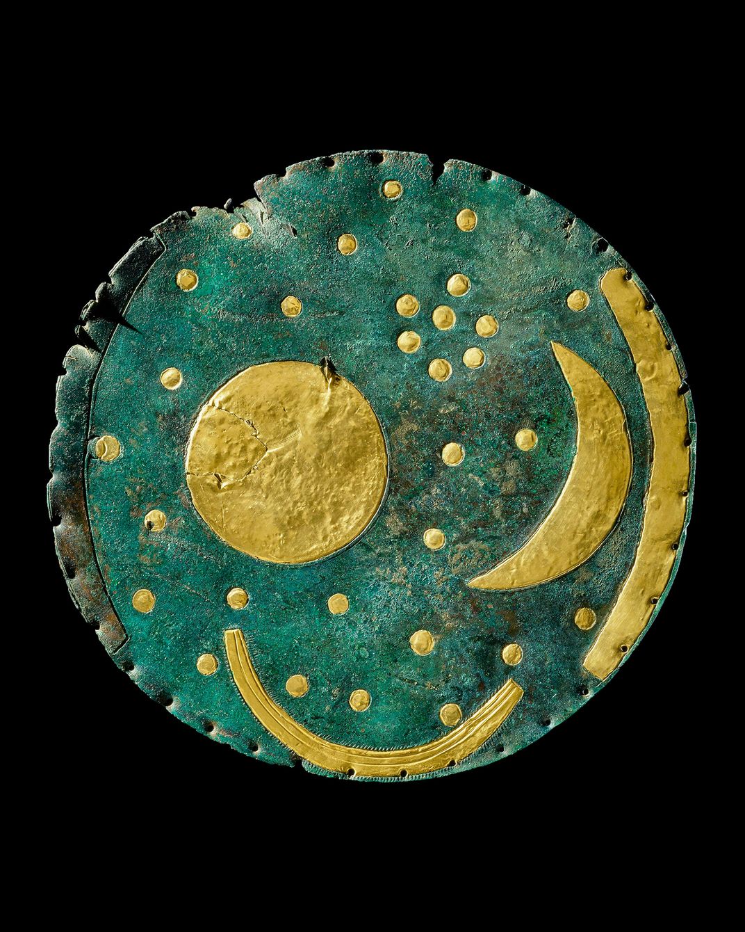 blue disc with brass colored depictions of sun, stars and moon