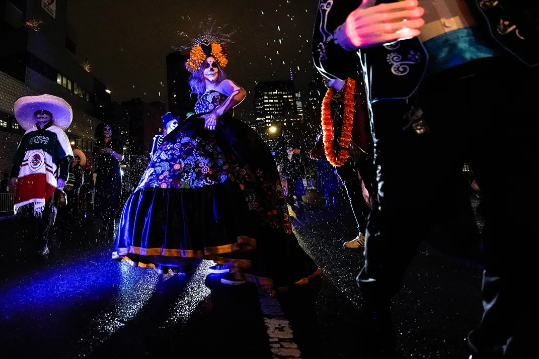 2 - Revelers practically glow in the dark as they march in New York City’s annual Village Halloween Parade.