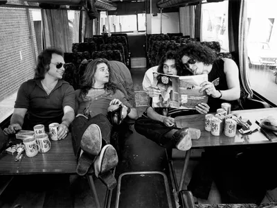 L to R: Michael Anthony, David Lee Roth, Eddie Van Halen and Alex Van Halen pose on a tour bus in 1978.