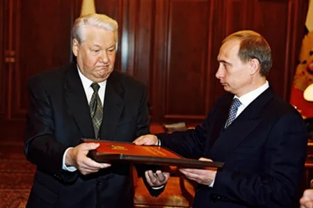 President Boris Yeltsin hands over a copy of the Russian constitution to Vladimir Putin, December 21, 1999. 