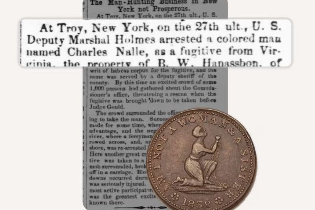 Newspaper clipping with a coin in front of it
