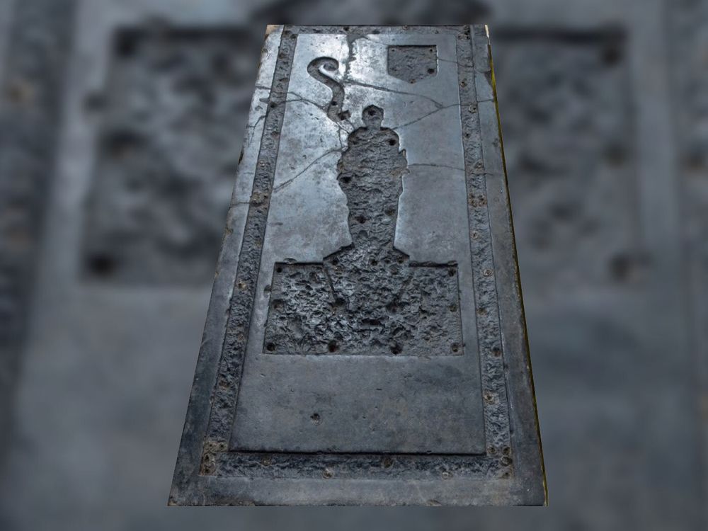 Black slab of stone with indentation
