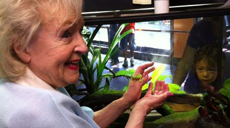 Actress Betty White holds a lemur leaf frog during her tour today at the National Zoo