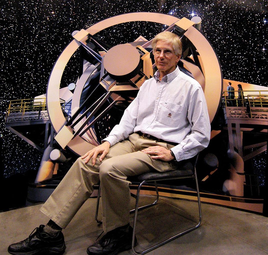 Tony Tyson with a model of the LSST telescope
