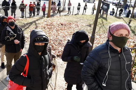 Residents of Washington, D.C. wait in line to get Covid-19 test kits in December of 2021. The United States lagged behind other nations in testing during the first few months of the pandemic.