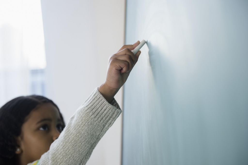 child at chalkboard