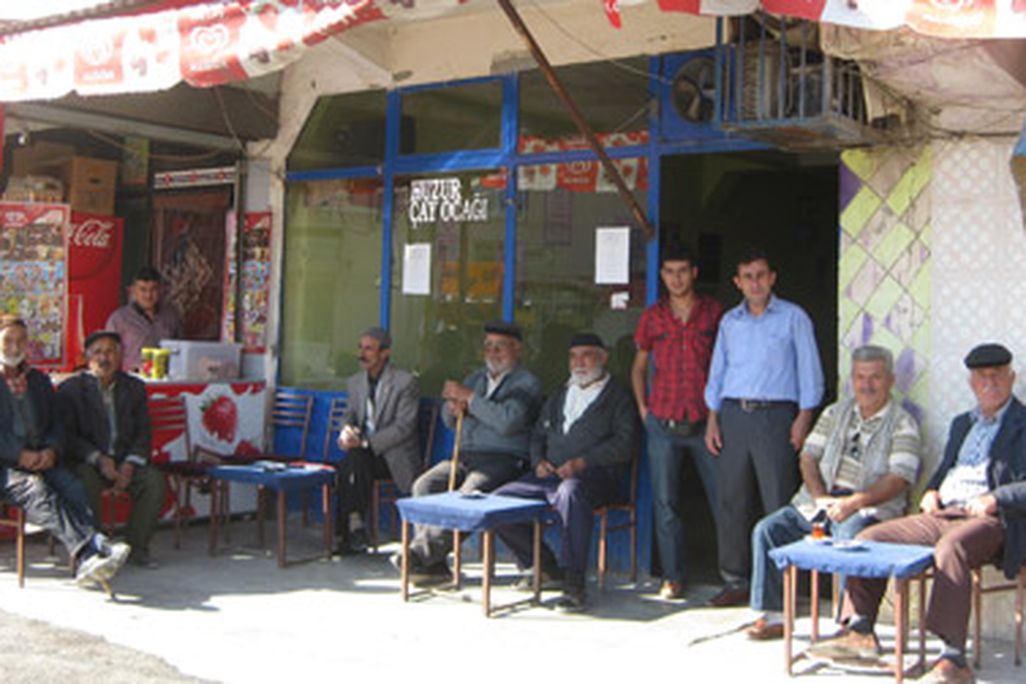 They may look friendly, but be warned: These village men will smother travelers with kindliness and drown them in tea.