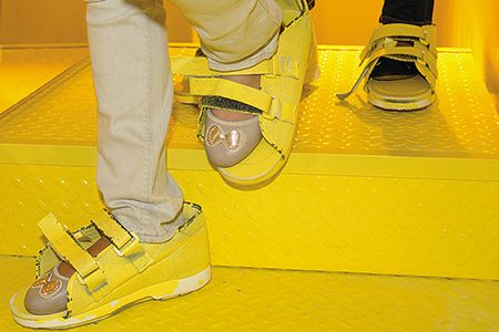 At the Israel Children’s Museum exhibit “Dialogue With Time,” visitors strap on heavy shoes to experience what it feels like for the elderly to climb a flight of stairs.