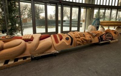 The Boxleys' totem pole, "The Eagle and the Chief," is currently being completed by the artists on public view in the Potomac Atrium of the American Indian Museum.